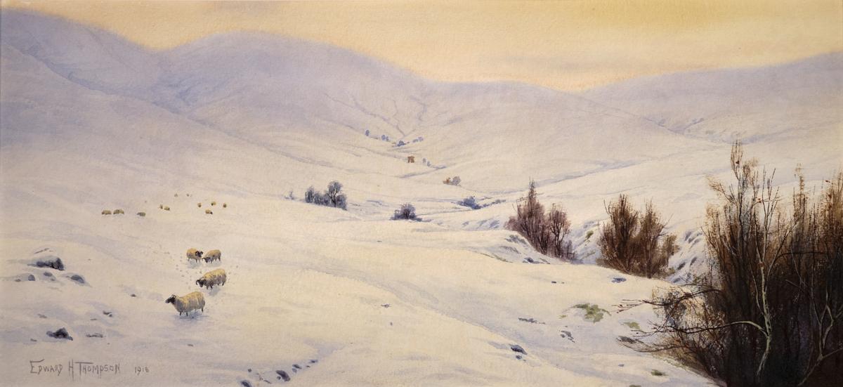 Image of a snowy landscape with hills in the background, bare dark brown trees in the right foreground, and sheep on the left side, both in the foreground and background. Artist signature of 'Edward H Thompson' on the bottom left.